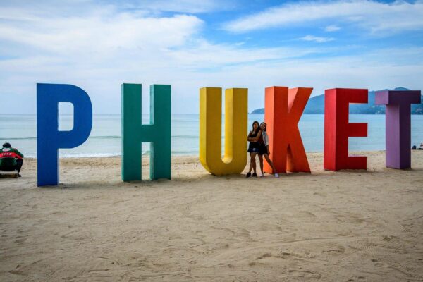 Beautiful flower arrangement in a glass vase on a rustic wooden table.