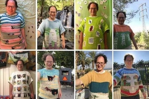 Amerikanischer Tourist strickt Pullover mit Wahrzeichen - warmes Tourismuskonzept.