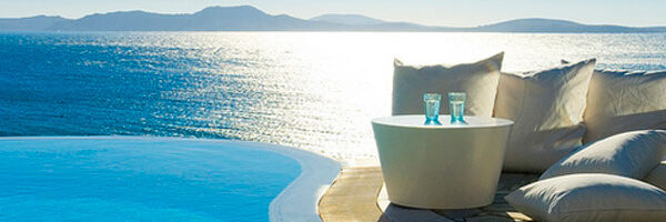 A close-up shot of a colorful bouquet of flowers on a wooden table.