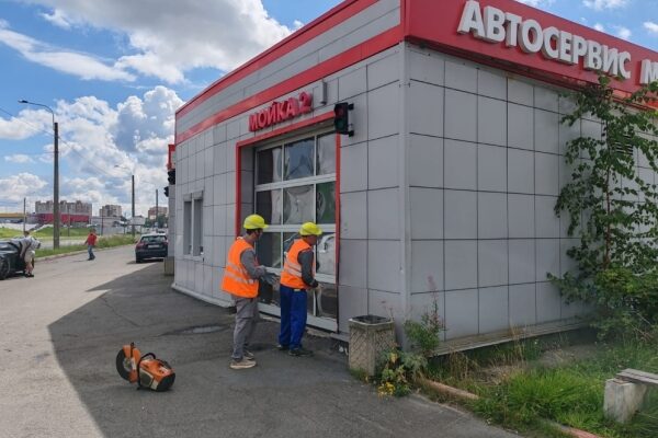 Professional business woman working on laptop at modern office desk